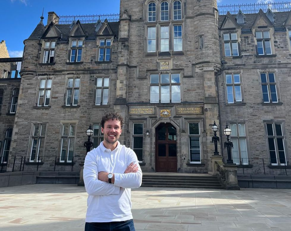 Dr John Martindale standing in front of the Edinburgh Futures Institute